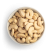 Natural cashews in white bowl freestanding