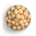 Sweet and salty macadamias in white bowl freestanding