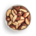 Organic Brazil nuts in white bowl freestanding