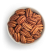 Pecan nuts in a white bowl