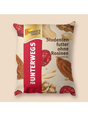 Puf en forma de bolsa con mezcla de frutos secos con arándanos rojos y sin pasas sultanas sobre fondo beige y logotipo Farmer's Snack