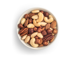 Roasted nut mixture consisting of blanched almonds, natural brown almonds, hazelnuts, pecans and cashews, presented as a freestanding white bowl.