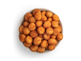 Macadamia Spicy with spice mix in white bowl, freestanding