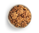 Natural walnuts in white bowl freestanding