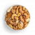 Mezcla de frutos secos con chips de coco y trozos de piña con mezcla de especias en un bol blanco, imagen aislada sobre fondo blanco